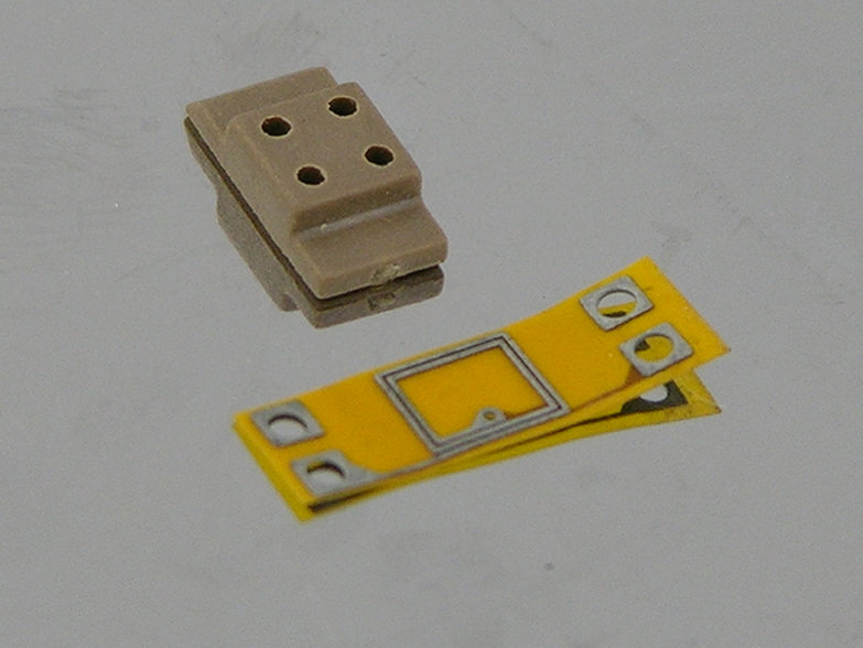 The coil and pillar before assembly